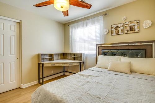 a bedroom with a bed and a ceiling fan at Fenced-In Pool and Patio Gilbert Home! in Gilbert