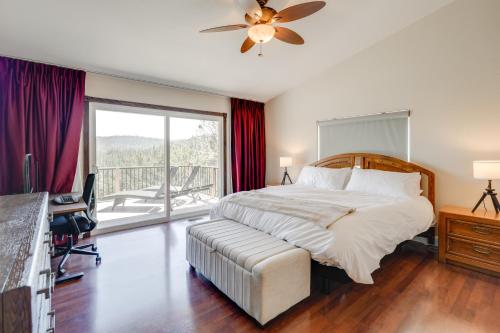 a bedroom with a bed and a desk and a window at Hot Tub and Game Room Family Retreat in Groveland! in Groveland