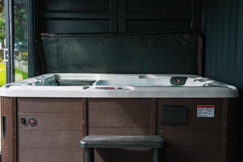 a kitchen with a sink and a stove at The Brambles Retreat in the Mournes in Annalong