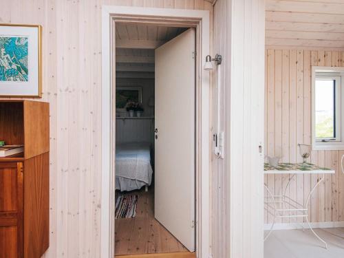a room with a door leading to a bedroom at 4 star holiday home in Blokhus-By Traum in Blokhus