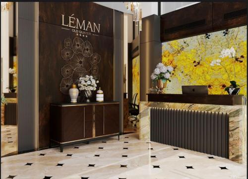 a lobby with a reception desk and flowers at Léman Old Quarter in Hanoi