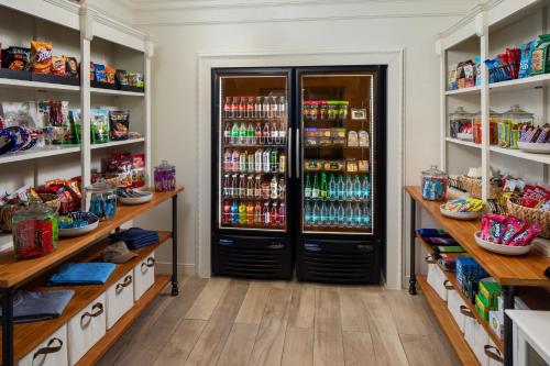a store room with a large refrigerator and shelves at The Inn at Long Beach in Long Beach