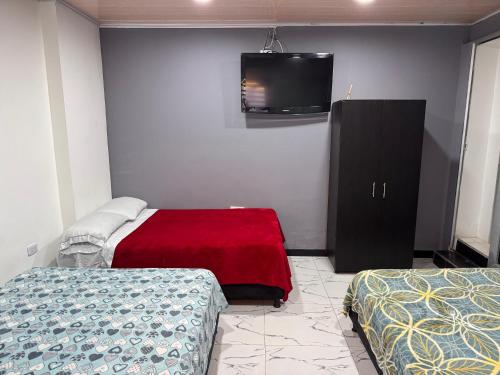 Cama o camas de una habitación en Hotel Bogotá Suites Teusaquillo