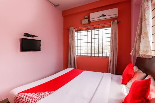 Ένα ή περισσότερα κρεβάτια σε δωμάτιο στο Super Hotel O Jeevan Residency