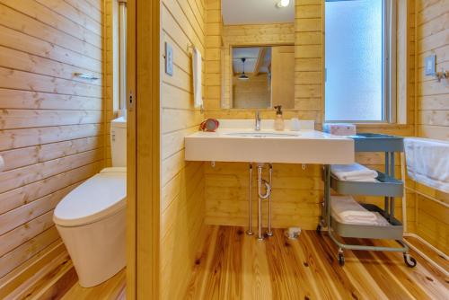 a bathroom with a sink and a toilet at Gotemba Kogen Tokinosumika in Gotemba