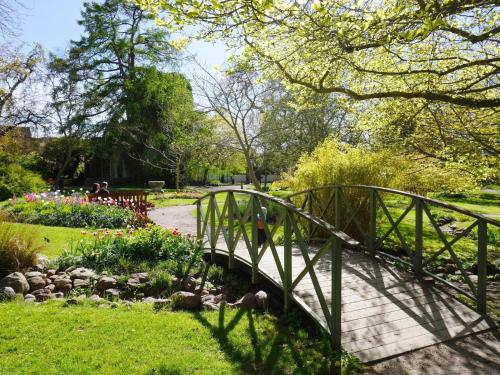 a bridge over a walkway in a park at 4 star holiday home in VISBY in Visby