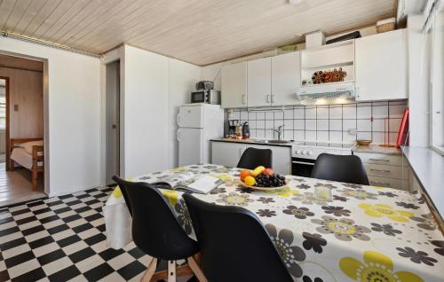 a kitchen and dining room with a table and chairs at Gorgeous Home In Sydals With Wifi in Østerby