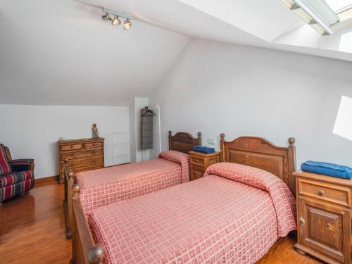 a bedroom with two beds in a room at Holiday Home in Loredo near Surf Beach in Loredo