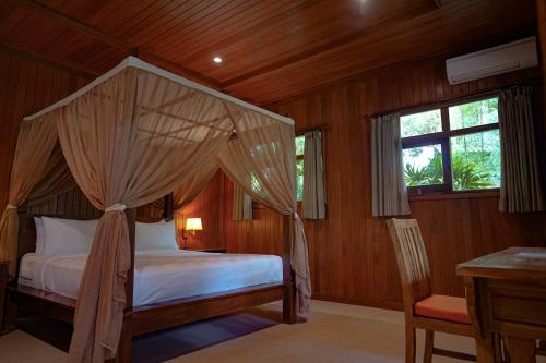 Postel nebo postele na pokoji v ubytování Pekak Mangku Guest House