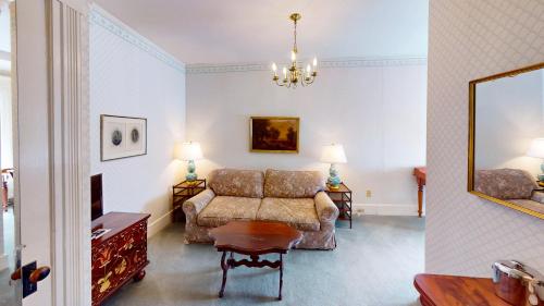 a living room with a couch and a table at The Red Lion Inn in Stockbridge