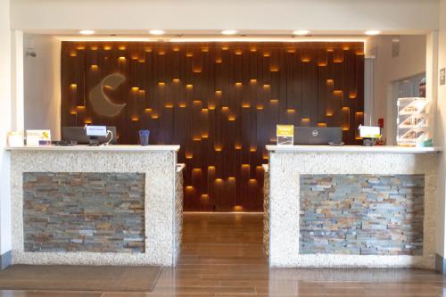 a lobby with a wall with lights on it at Comfort Suites Texarkana Texas in Texarkana - Texas