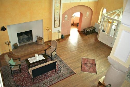 an aerial view of a living room with a fireplace at Schloss Lelkendorf, Fewo Hoppenrade in Lelkendorf