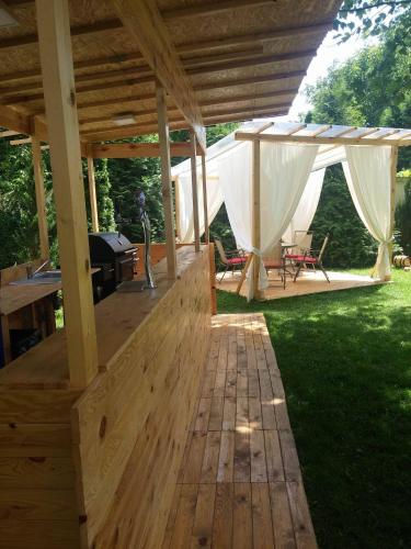 a wooden deck with a tent in a yard at Hotel Imperial Premium in Timişoara