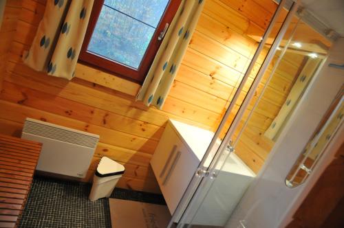 an overhead view of a bathroom with a shower in a room at Abri Vert in Oignies-en-Thierache