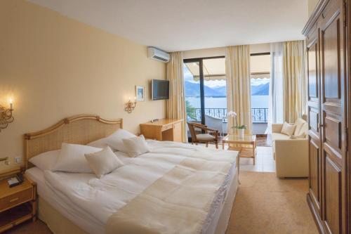 Postel nebo postele na pokoji v ubytování Boutique Hotel La Rocca