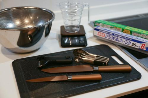 a knife on a black tray on a counter at 61 Fuji Petel UN -アン- in Fujikawaguchiko