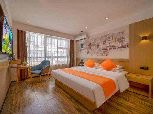 Giường trong phòng chung tại City Comfort Inn Zhanjiang Central People's Hospital High-speed Railway Station
