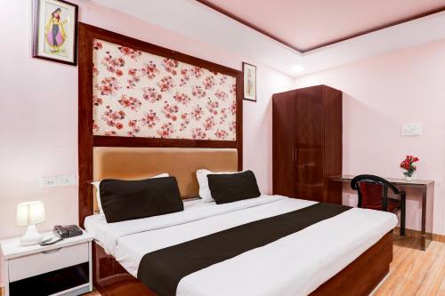 Cama o camas de una habitación en Super Hotel O BBD Lucknow Formerly 7th Heaven