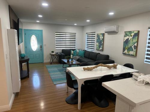 a living room with a couch and a table at Coastal Calm Casita in Long Beach