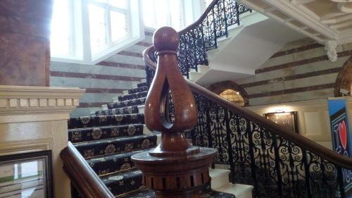 a spiral staircase in a house with a stair case at Crown & Mitre Hotel in Carlisle