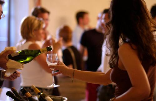 a group of people drinking wine at a party at Terme Villa Pace in Abano Terme