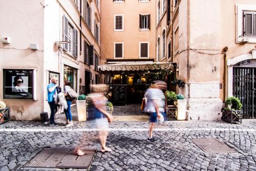 a group of people walking down a street at Ostello Villa Monte Mario in Rome