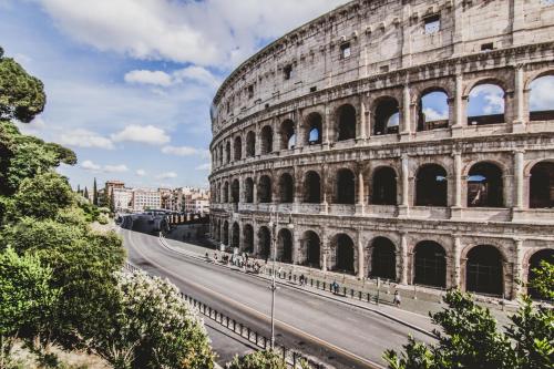 an empty street in front of the coliseum at Ostello Villa Monte Mario in Rome