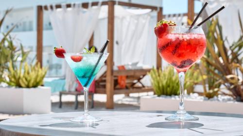 two cocktails sitting on top of a table at Hotel Ankaa - Adults Only in Porto Cristo