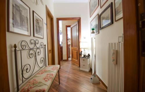 a room with a hallway with a bench and pictures on the walls at Stunning Apartment In Monteleone Sabino With Wifi in Monteleone Sabino