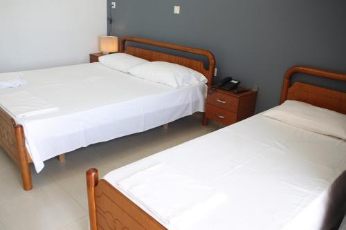 Ένα ή περισσότερα κρεβάτια σε δωμάτιο στο La Maroja View Hotel