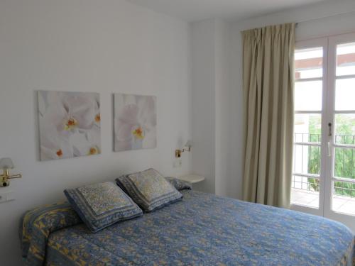 Ένα ή περισσότερα κρεβάτια σε δωμάτιο στο La Platera Villas