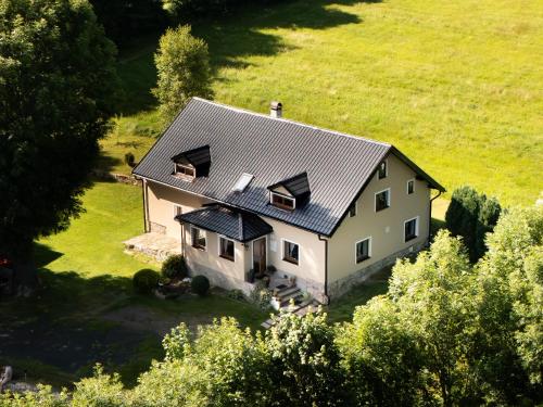 an aerial view of a house with a metal roof at Chalupa Háj in Jindřichovice