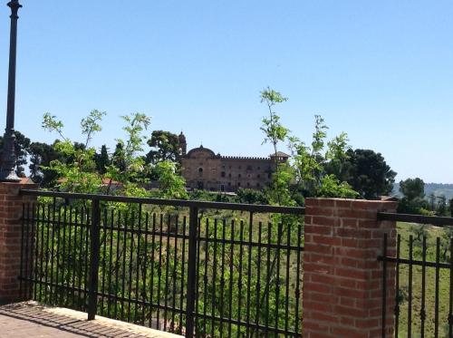 a black wrought iron fence with a building in the background at BellaVista Bike Stop in Spoltore
