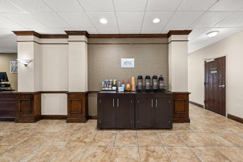 a lobby with a bar with bottles of wine at Sleep Inn Boone University Area in Boone
