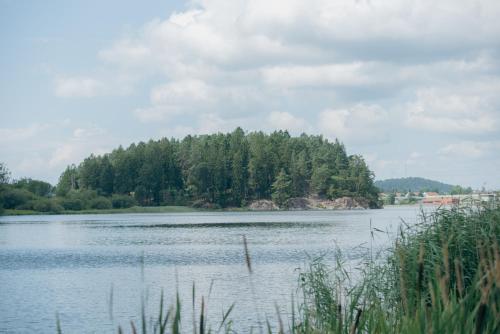 a large body of water with trees in the background at Kungälvs Bed & Brekfast in Kungälv