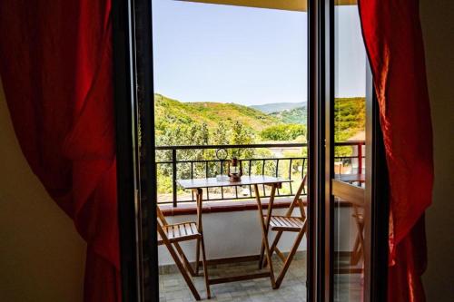 a view of a balcony with a table and chairs at Hotel Palinuro Cilentiamoci rooms in Palinuro