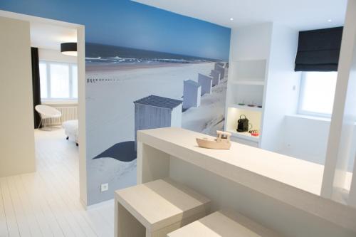 a living room with a view of the beach at Villa Emilia in De Haan