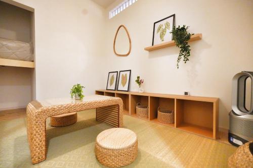 a living room with a table and a tv at miraisya kyojima in Tokyo