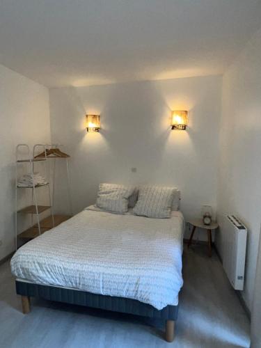 Ένα ή περισσότερα κρεβάτια σε δωμάτιο στο Appartements Cosy, Centre de Rosendaël, HomyNest