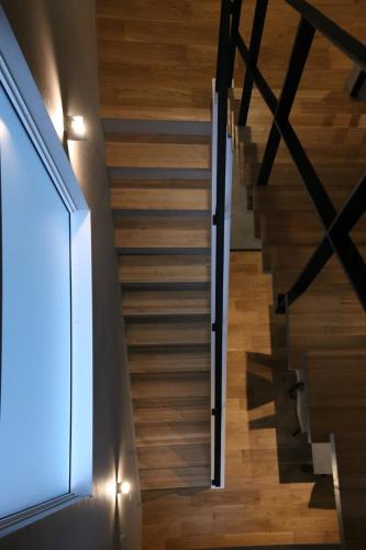 a staircase in a house with wooden floors at 62 Fuji Petel DEUX -ドゥ- in Fujikawaguchiko