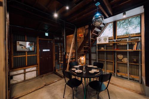 a dining room with a table and chairs at Ivy Harajuku in Tokyo