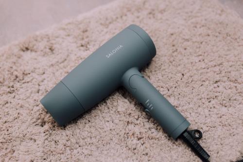 a wii remote laying on top of a carpet at Ivy Harajuku in Tokyo