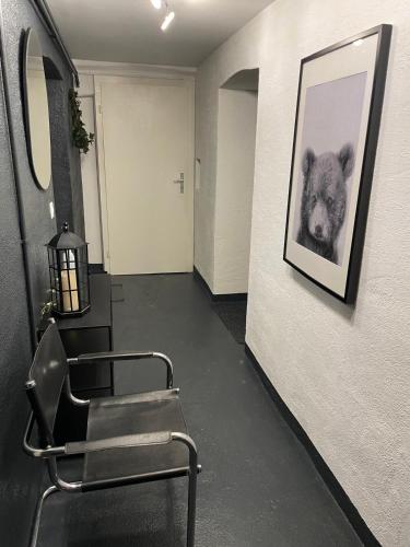 a room with chairs and a picture of a koala on the wall at Sweet Home in Murten