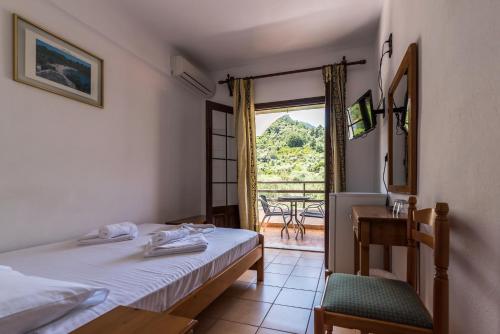 Postel nebo postele na pokoji v ubytování Hotel Sylvia