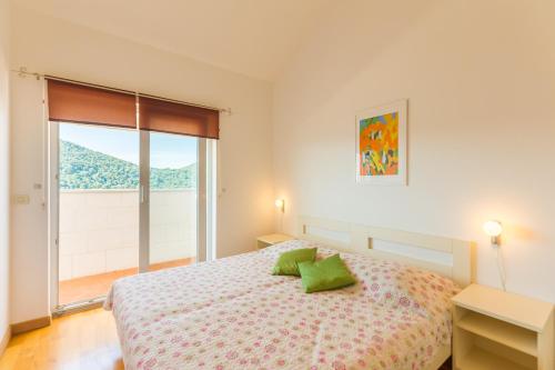 Uma cama ou camas num quarto em Apartments Margaretic