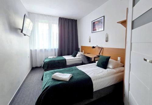 Postel nebo postele na pokoji v ubytování Hotel Orbita