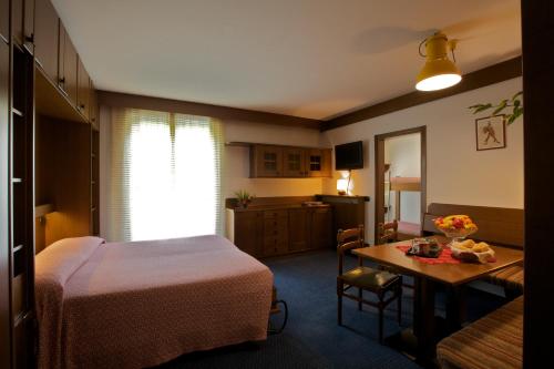 Postel nebo postele na pokoji v ubytování Hotel Carlone