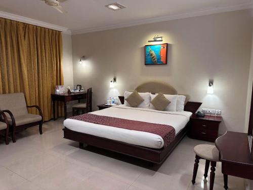 Postel nebo postele na pokoji v ubytování Hotel Sabari Park