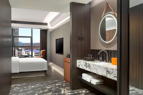 Ένα ή περισσότερα κρεβάτια σε δωμάτιο στο Days Hotel by Wyndham Zhuzhou Liling