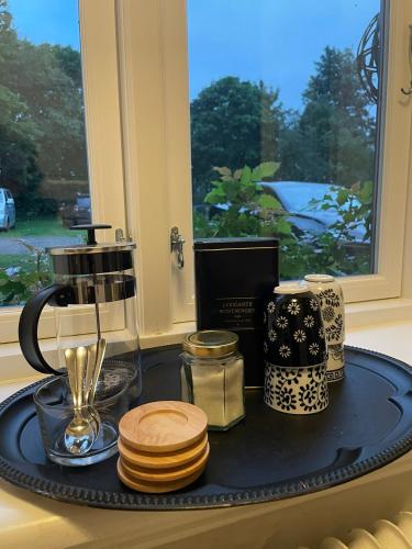 a kitchen counter with a tray with various items on it at Tullesbo Sätesgård in Sjöbo